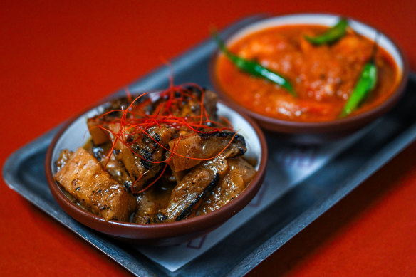 The blackened pineapple curry (left) and prawn curry.