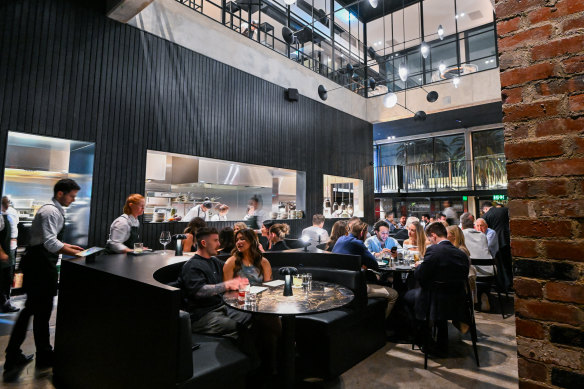 Saint Dining is situated in an atrium surrounded by soaring red brick walls.