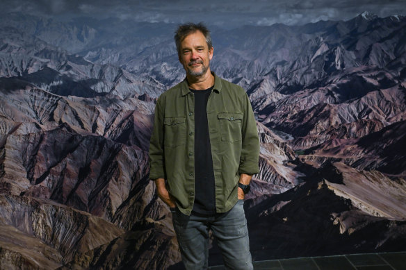 Murray Fredericks in front of one of his earliest landscapes, shot in Ladakh.