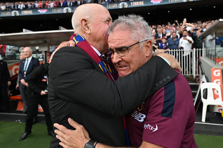 Leigh Matthews embraces Chris Fagan after the siren.