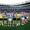 Collingwood and Melbourne players pause in memory of Neale Daniher 