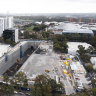 Excavators at work Wednesday on the site of a train station at Sydney Olympic Park for the Metro West line. 