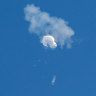 The suspected Chinese spy balloon drifts to the ocean after being shot down off the coast from Surfside Beach, South Carolina.