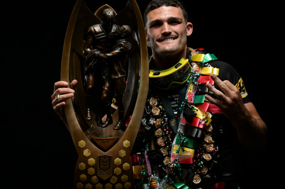 Nathan Cleary poses with the NRL premiership trophy after Penrith’s third straight grand final win.