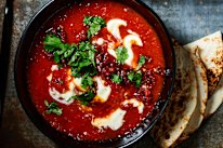 Creamy chipotle tomato soup with crispy chorizo and toasted seeds.