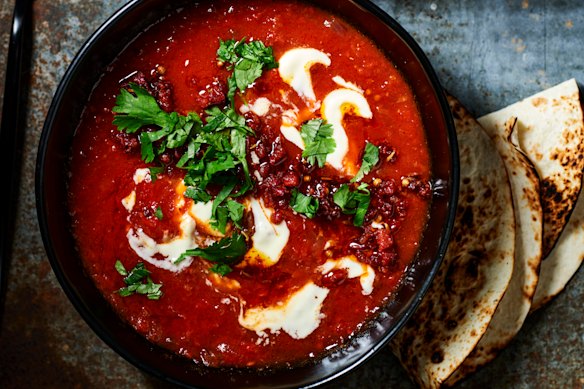 Creamy chipotle tomato soup with crispy chorizo and toasted seeds.