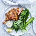 Veal cotoletta with spring vegetables and anchovy.