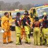 Qld firefighters 'regrouping' before fire threat ramps up on the weekend