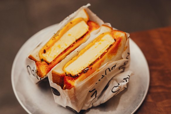Steamed custard egg sandwich with chilli oil.