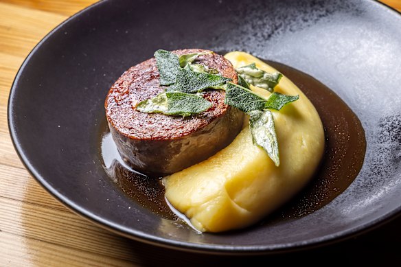 Cotechino sausage with buttery mashed potato, jus and crispy sage leaves.