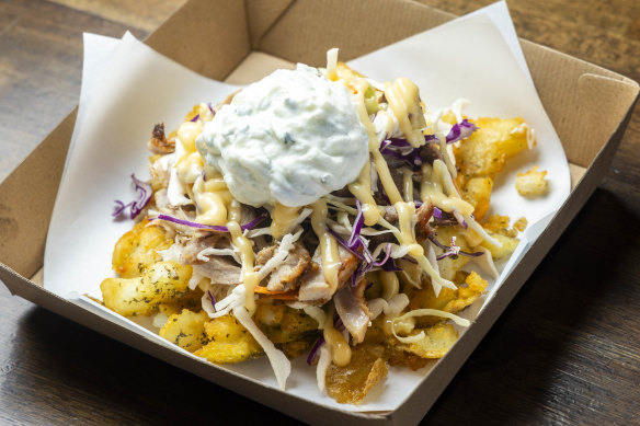 The Secret Spud - double-cooked chat potatoes loaded with chicken and lamb gyros, coleslaw and tzatziki.