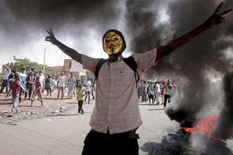 A man flashes the victory sign during a protest to denounce the October 2021 military coup, in Khartoum, Sudan in January. 