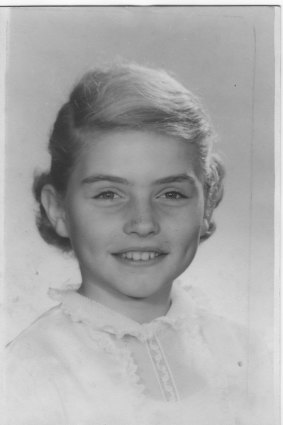 Debbie’s mother liked to dress her in prim white blouses and navy-blue skirts.