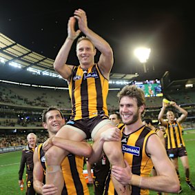 Brad Sewell is chaired off for his 200th and final match in 2014. He retired with two premierships.