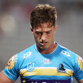 Titans’ Sam Verrills looking dejected as he leaves the field during the round two NRL match against the Dragons .