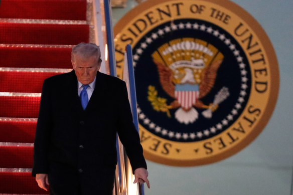 US President Donald Trump walks down the stairs of Air Force One upon his arrival from Florida. 