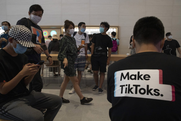 A visitor to an Apple store in Beijing wears a T-shirt promoting TikTok.