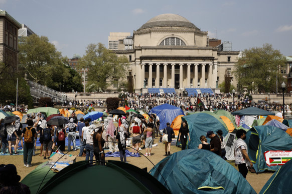 Students protesters gather at their encampment on the Columbia University campus.