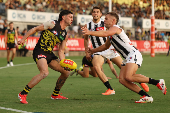 Tim Taranto handballs under pressure.
