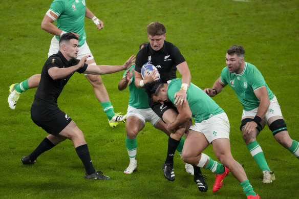 New Zealand’s Jordie Barrett, centre, runs with the ball during the Rugby World Cup quarterfinal match between Ireland and New Zealand at the Stade de France in Saint-Denis, near Paris.