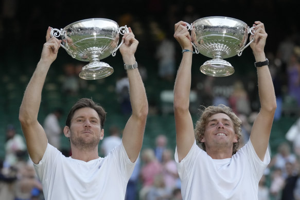 Matthew Ebden, left, and Max Purcell of Australia celebrate with their trophies after beating Mate Pavic and Nikola Mektic of Croatia to win the final of the Wimbledon men’s doubles.
