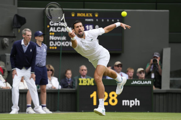 Novak Djokovic returns the ball to Carlos Alcaraz during the men’s singles final at Wimbledon.