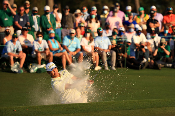 Hideki Matsuyama plays out of the bunker on the 18th hole.