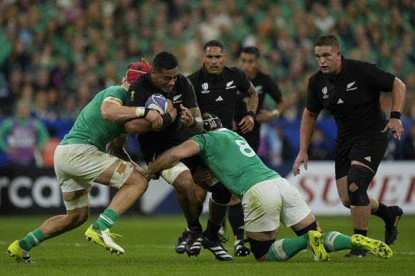 New Zealand’s Shannon Frizell is tackled during the Rugby World Cup quarterfinal match between Ireland and New Zealand.