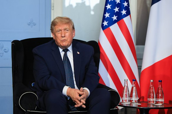 Donald Trump, attending the G7 in Evian, France, said it was unlikely he would stay in Europe to sign the peace deal.