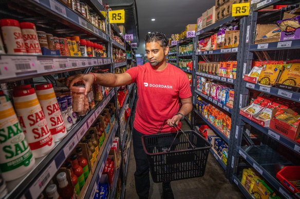 A worker at a DashMart store. Frontline staff were not affected by the layoffs.