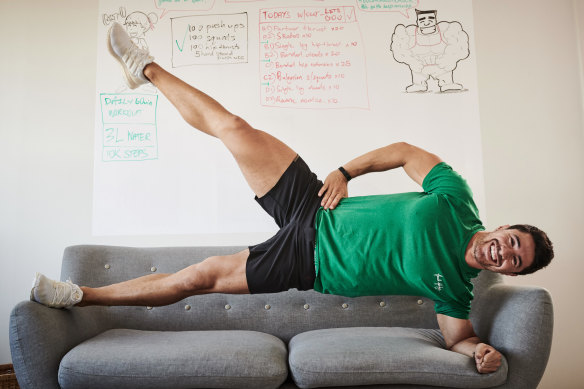 Couch potatoes, move over … Brock Ashby shows his home-based clients how to keep fit using furniture.