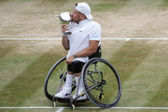 Dylan Alcott celebrates his Wimbledon win.