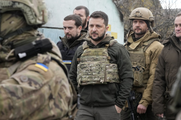 Ukrainian President Volodymyr Zelensky arrives in Bucha to see the devastation on Tuesday.