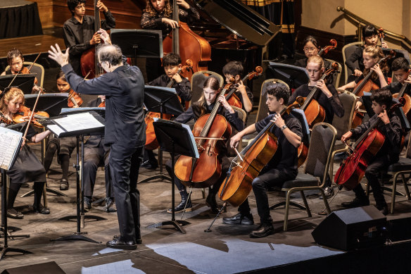 Participants from the Melbourne Youth Orchestras’ summer school performing at Melbourne Town Hall. 