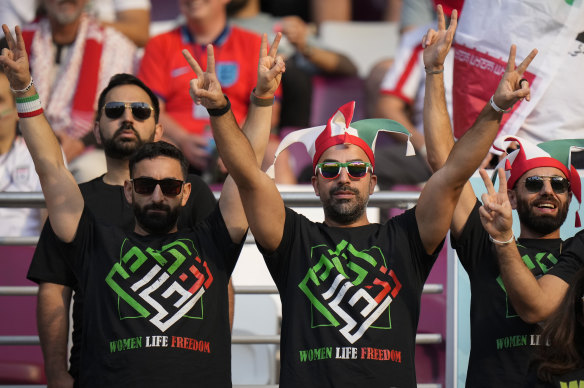 Iranian fans at the stadium make their own statements.