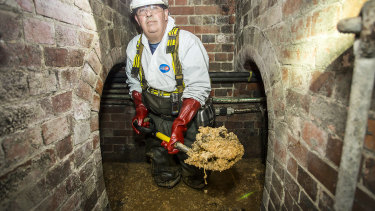 A Thames Water worker removes part of the fatberg beneath Whitechapel in London.