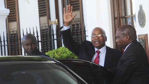 South African President Jacob Zuma waves as he leaves parliament in Cape Town on Tuesday.