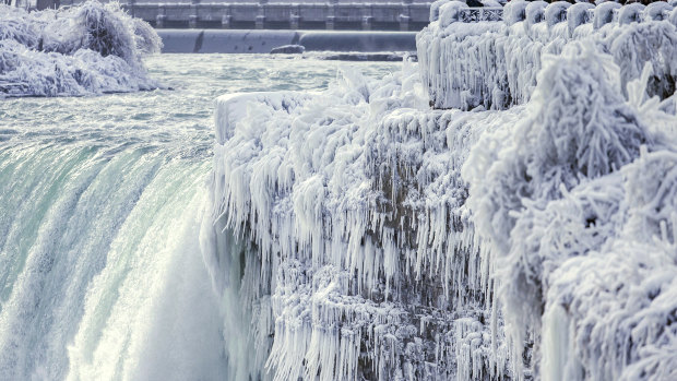 Niagara Falls freezes over as temperatures in North America plummet.