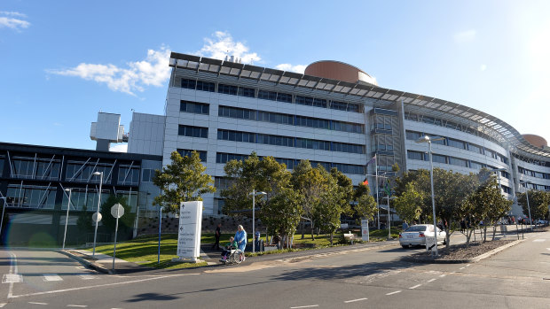 The process will take 18 months, as cladding two-and-a-half times the size of the Suncorp Stadium playing surface is removed and replaced at the Princess Alexandra Hospital.