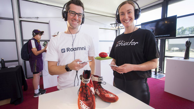 Greg Curico, co-founder or Roamni, and Tahnee Woodham from RMIT Activator with a replica pair of Ricciardo's shoes. 