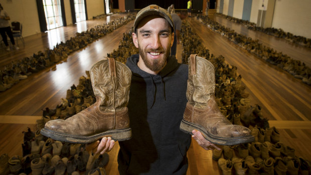 Liam Riseley with his new-found cowboy boots.