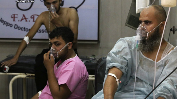 Syrians wear oxygen masks after a  chemical weapons attack in 2016. 