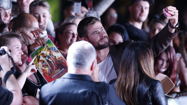 Chris Hemsworth obliges to fans for a selfie as he walks the red carpet during the Thor: Ragnarok Australian Premiere at Event Cinemas in Robina on the Gold Coast.