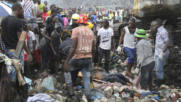 Rescuers search for survivors after a garbage mound collapsed on homes in Maputo, Mozambique.