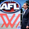 AFL CEO Andrew Dillon arrives to speak to media during a press conference in Melbourne.