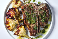 Sizzling T-bone steaks are paired with a tangy salsa verde and artichoke chips in this summer recipe.