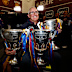 Brisbane coach Chris Fagan with the last three premiership cups. 