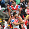 Dragons stars Tyrell Sloan and Ben Hunt celebrate a try.