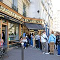 Visitors queue at a patisserie in Paris featured on the Netflix series Emily in Paris.