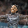 Simone Biles competes on the balance beam during a women’s artistic gymnastics qualification round. 